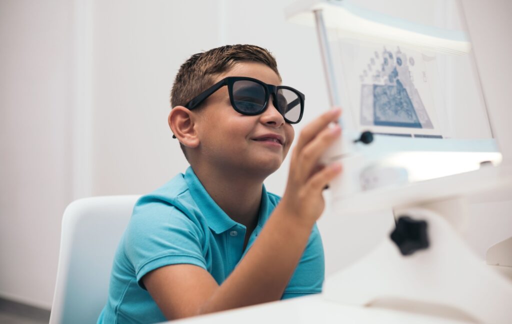 A young child completes a vision therapy activity to support their concussion recovery and minimize visual disturbances.