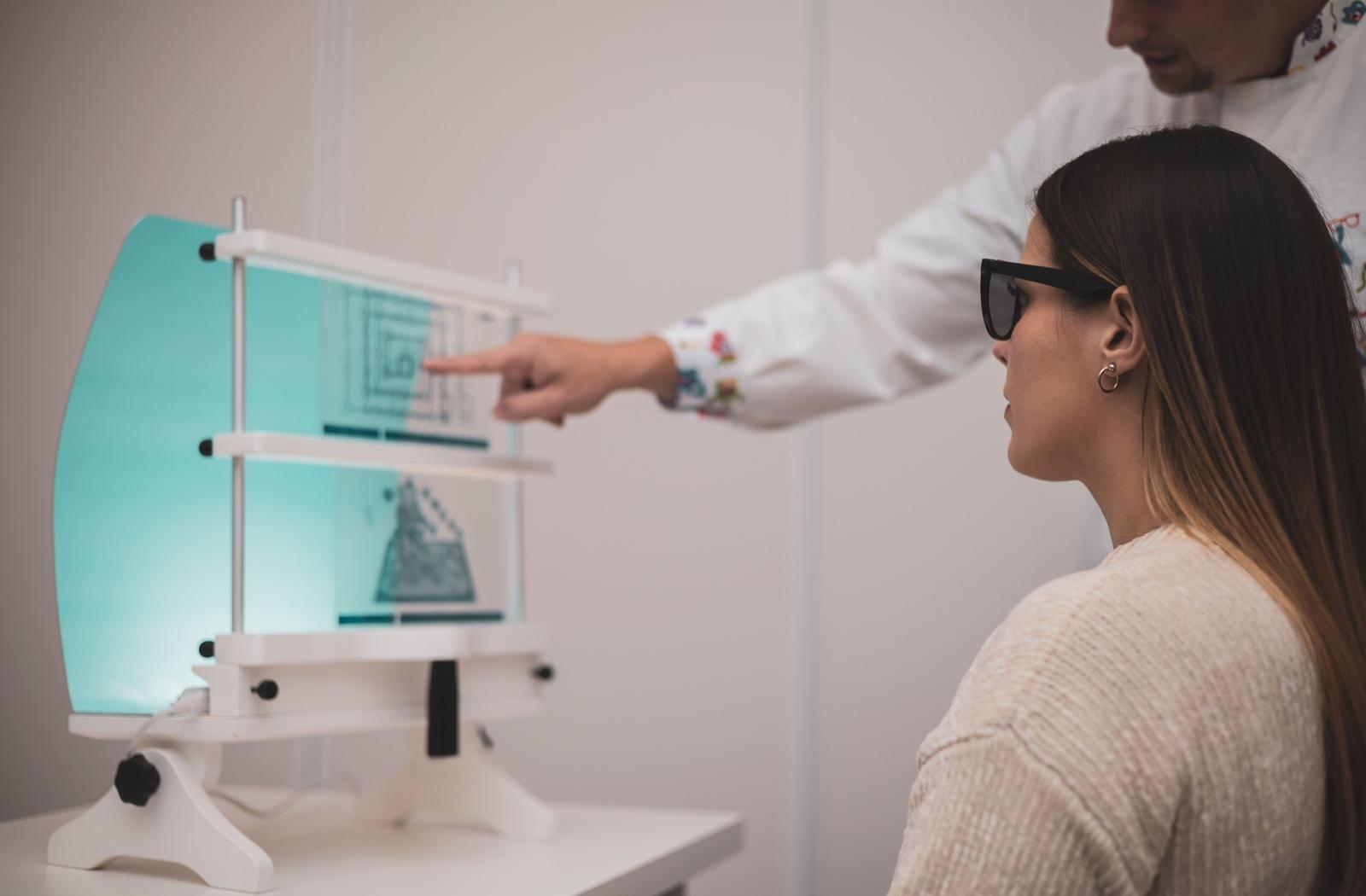 A patient with binocular vision dysfunction at a vision therapy appointment at their optometrist's office.